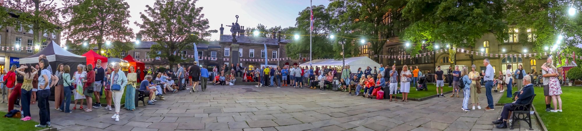 Crowds enjoying an evening in Glossop's Norfolk Square during Heritage Weekend 2026