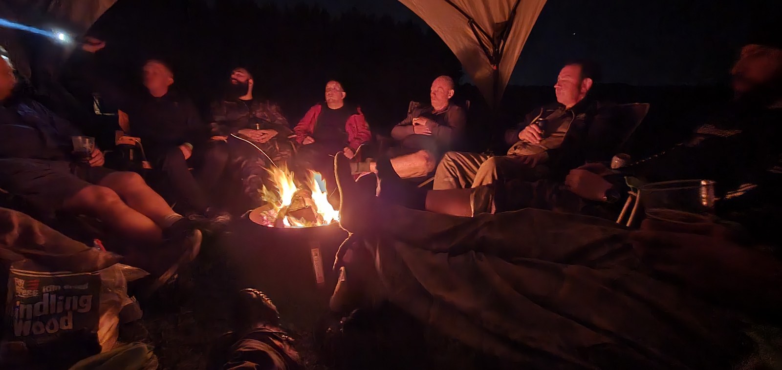 Glossop Round Table members around the campfire at the Woodland Games 2023